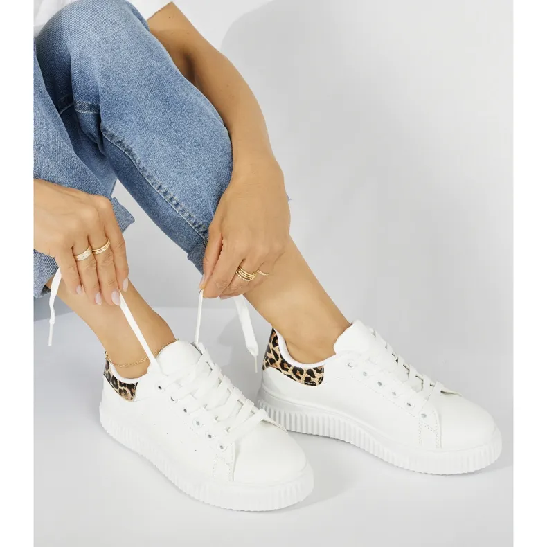 White women's sneakers with a leopard print element